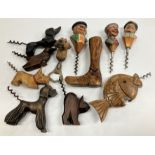 A collection of carved wooden handled corkscrews with figural / animal, etc.