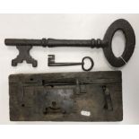 An 18th Century wooden and iron door lock, 33 cm x 14.