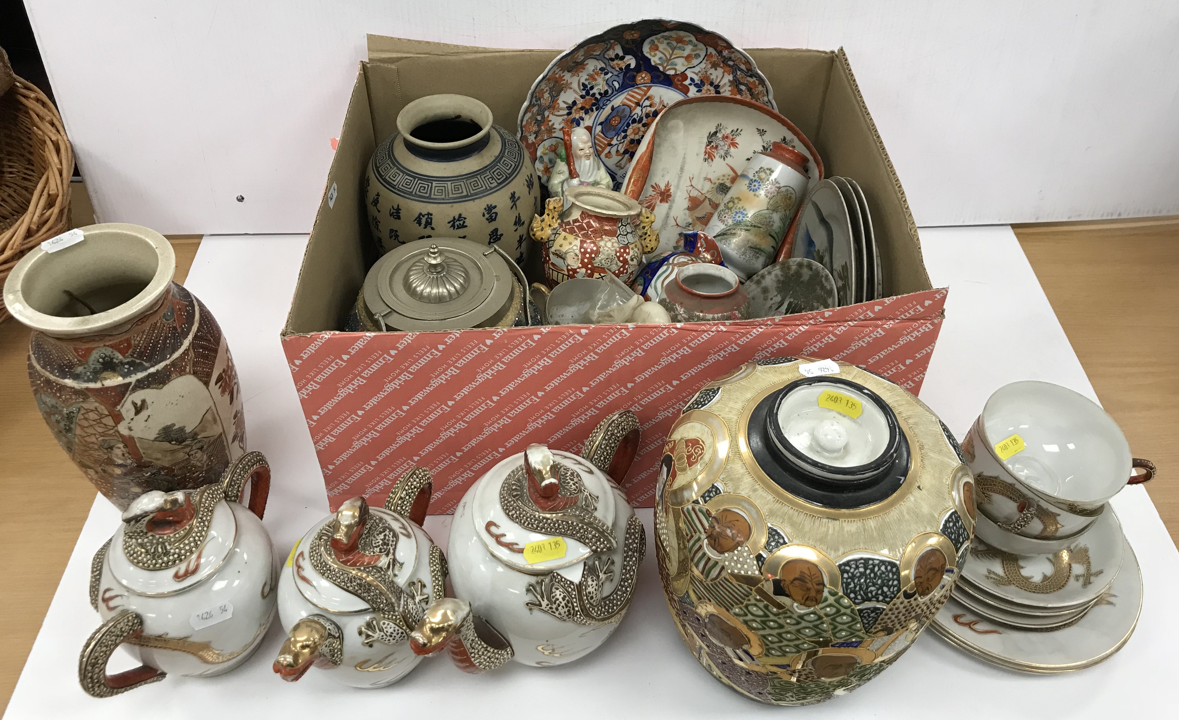 A collection of various Japanese and Chinese pottery and porcelain including a Japanese dragon