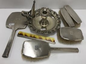 An engine turned silver back three piece dressing table brush and mirror set each engraved MG to