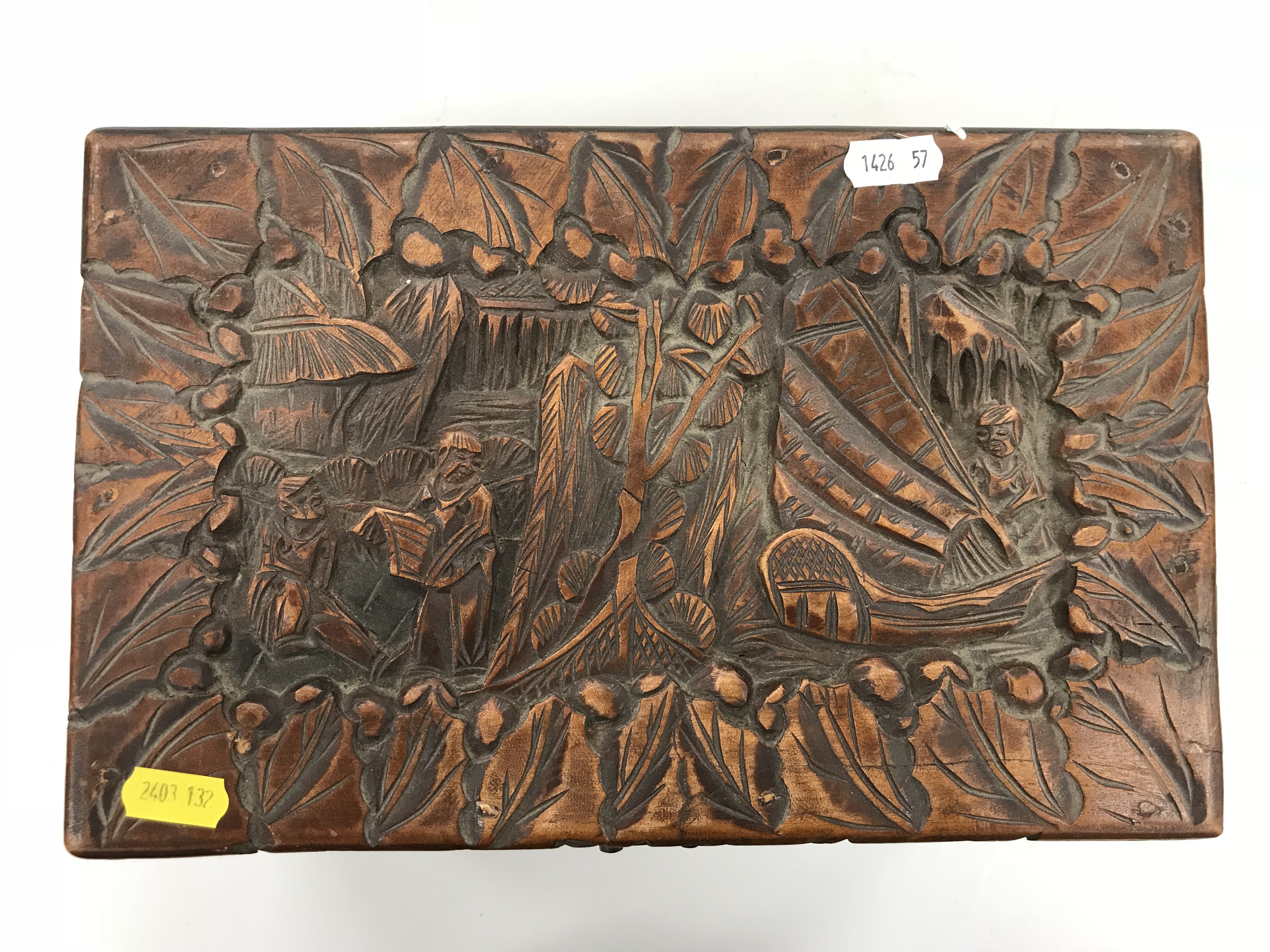 An Indonesian carved camphor wood miniature trunk with all over figural and foliate decoration - Image 5 of 8