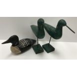 A modern Bundy folk art duck decoy stamped to base "Bundy & Company John E Bundy made in USA" with