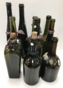A collection of ten 19th Century and later black/green glass bottles various, shortest 24.