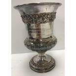 A George IV silver goblet with grape and vine decoration and gadrooned base with acanthus leaf
