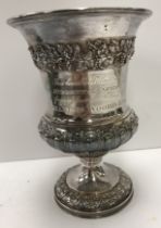A George IV silver goblet with grape and vine decoration and gadrooned base with acanthus leaf
