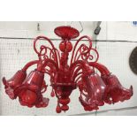 A Murano ruby glass eight branch electrolier with flower head design shades approx.