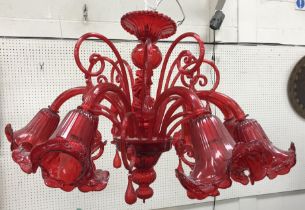 A Murano ruby glass eight branch electrolier with flower head design shades approx.