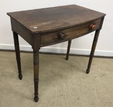 An early 19th Century mahogany bow fronted side table,