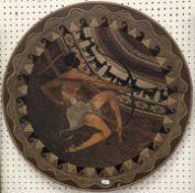 A circa 1900 carved and painted plaque or tabletop decorated with a South American warrior with bow