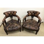 A pair of late Victorian walnut framed brown buttoned leather upholstered salon chairs with reeded