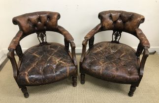 A pair of late Victorian walnut framed brown buttoned leather upholstered salon chairs with reeded
