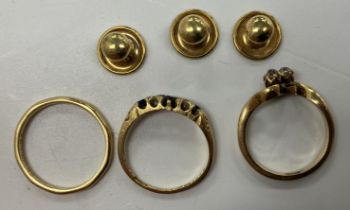 An 18 carat gold plain wedding band, size P, an 18 carat gold sapphire and diamond five stone ring,