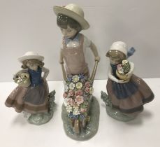 A collection of Lladro figures comprising "Little Gardener" figure of a young boy with wheelbarrow