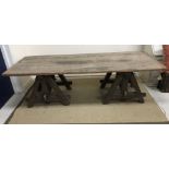A late 19th/early 20th Century French oak low trestle table, 126 cm long x 86 cm wide x 65.