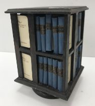 A miniature revolving bookcase containing 40 volumes of "The Works of William Shakespeare",