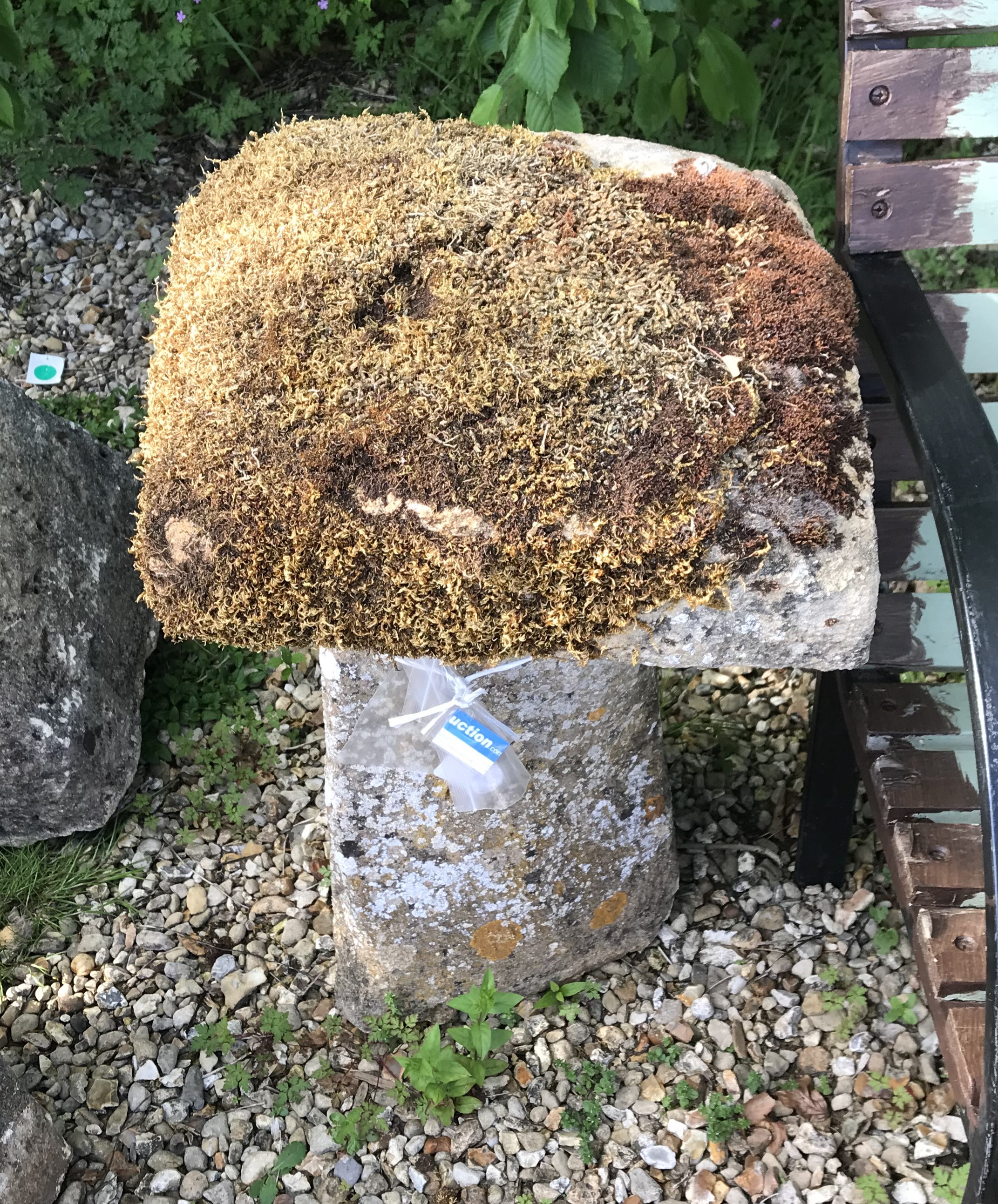 Two natural stone staddle stones, one with square top,