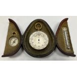 A circa 1900 gilt brass cased compensated barometer with silvered dial by The Army & Navy
