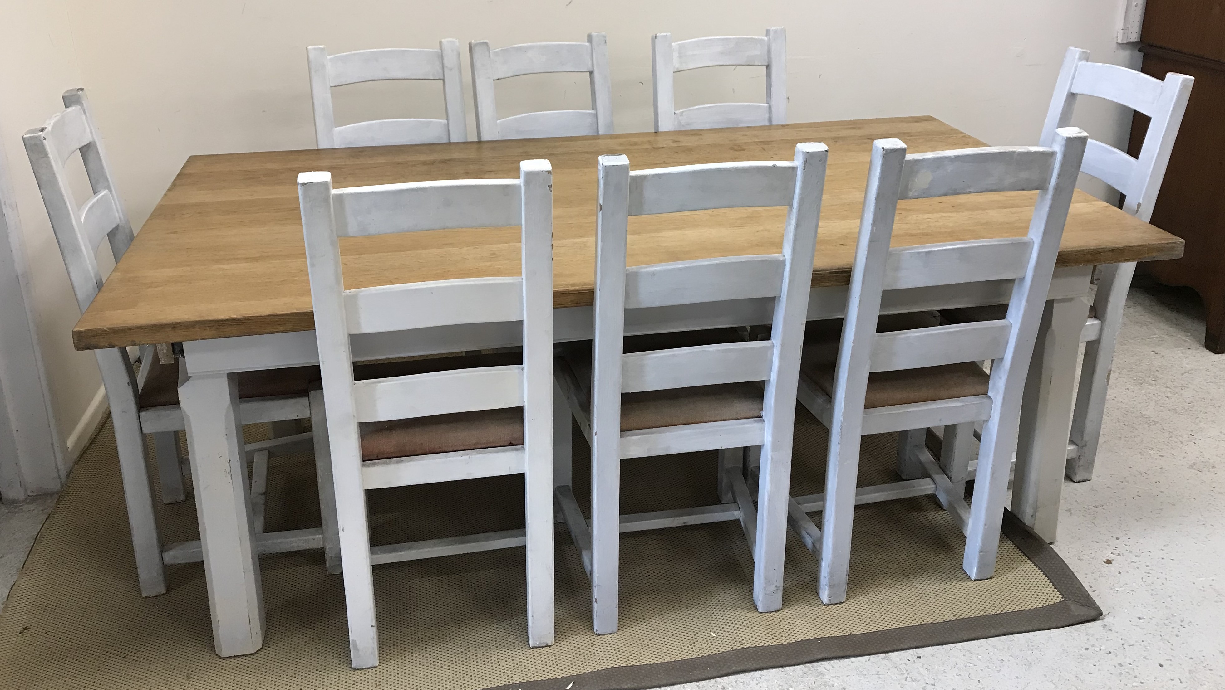 A modern oak and painted farmhouse style kitchen table,