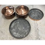 Two traditional Cypriot copper cooking vessels and covers, one 40 cm diameter x 20 cm high,