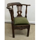 A 19th Century oak corner chair in the 18th Century style,