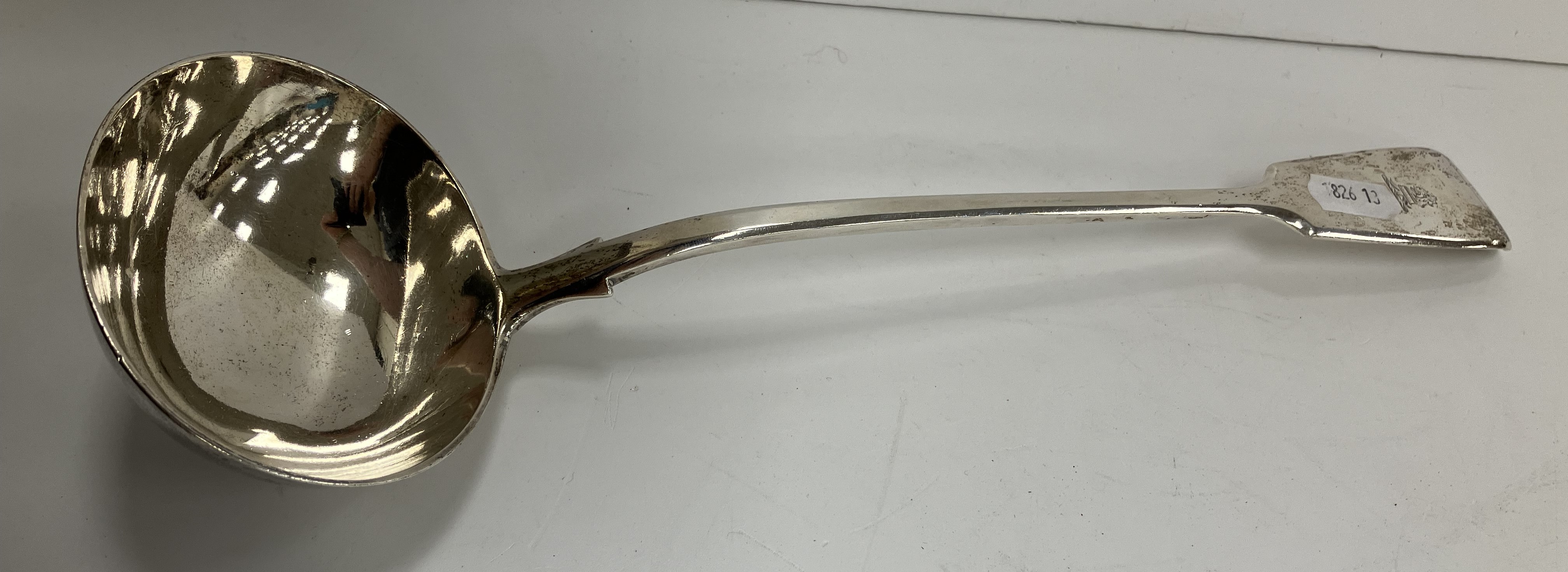 A Victorian silver "Fiddle" pattern soup ladle (by George W Adams for Chawner & Co, London 1877) 33.