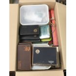 Four boxes of unsorted/loose British and World stamps in various boxes,