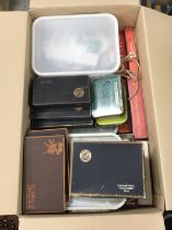 Four boxes of unsorted/loose British and World stamps in various boxes,