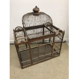 A decorative hardwood and wire bird cage with domed top detail 83 cm wide x 45 cm deep x 102 cm