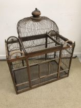 A decorative hardwood and wire bird cage with domed top detail 83 cm wide x 45 cm deep x 102 cm