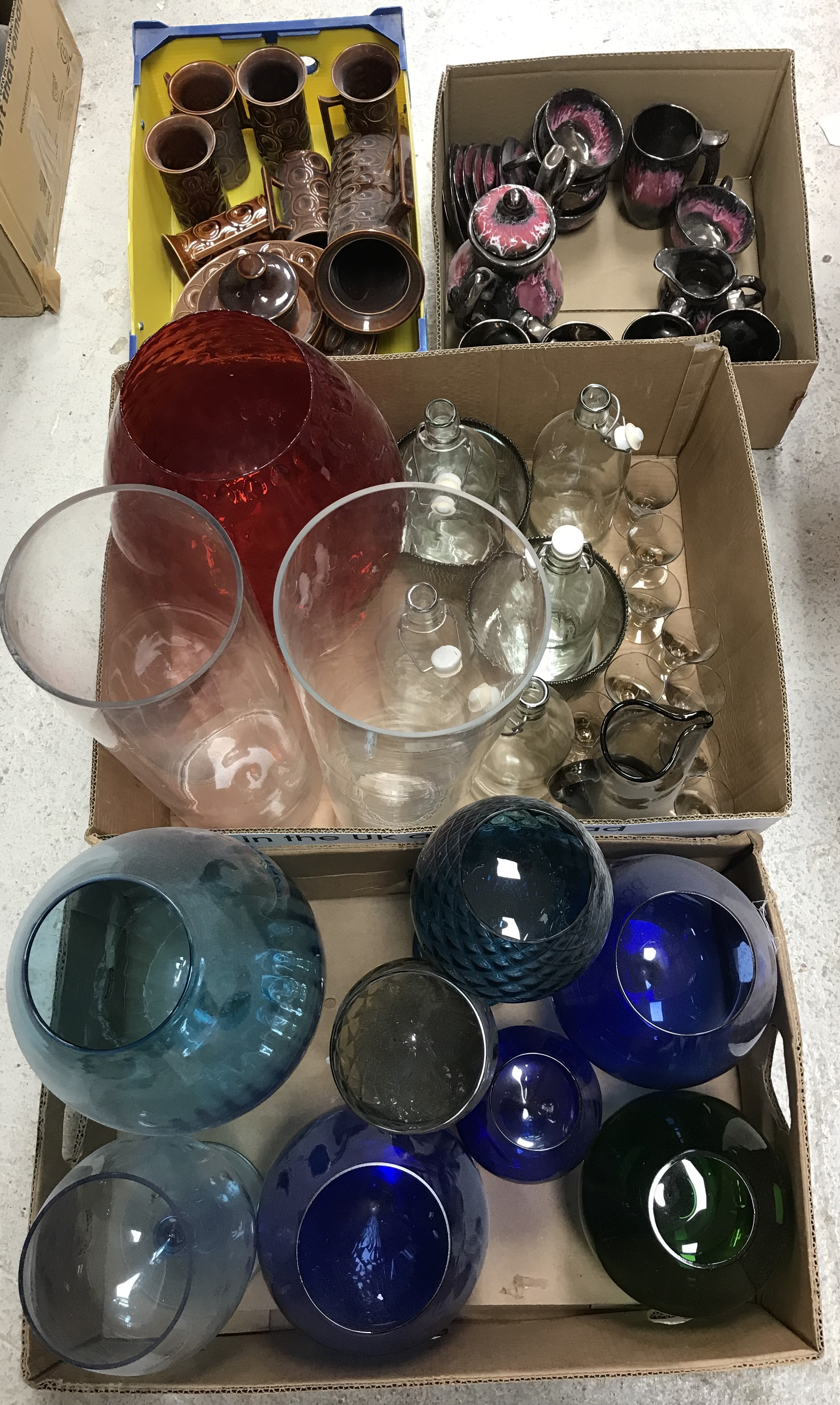 Two boxes of assorted mid 20th Century coloured glass vases as over sized goblets,