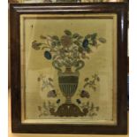 A 19th Century felted picture depicting Classical twin handled urn with floral sprays and