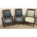 A set of three late 19th Century French Empire Revival mahogany framed open arm chairs,