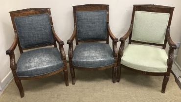 A set of three late 19th Century French Empire Revival mahogany framed open arm chairs,