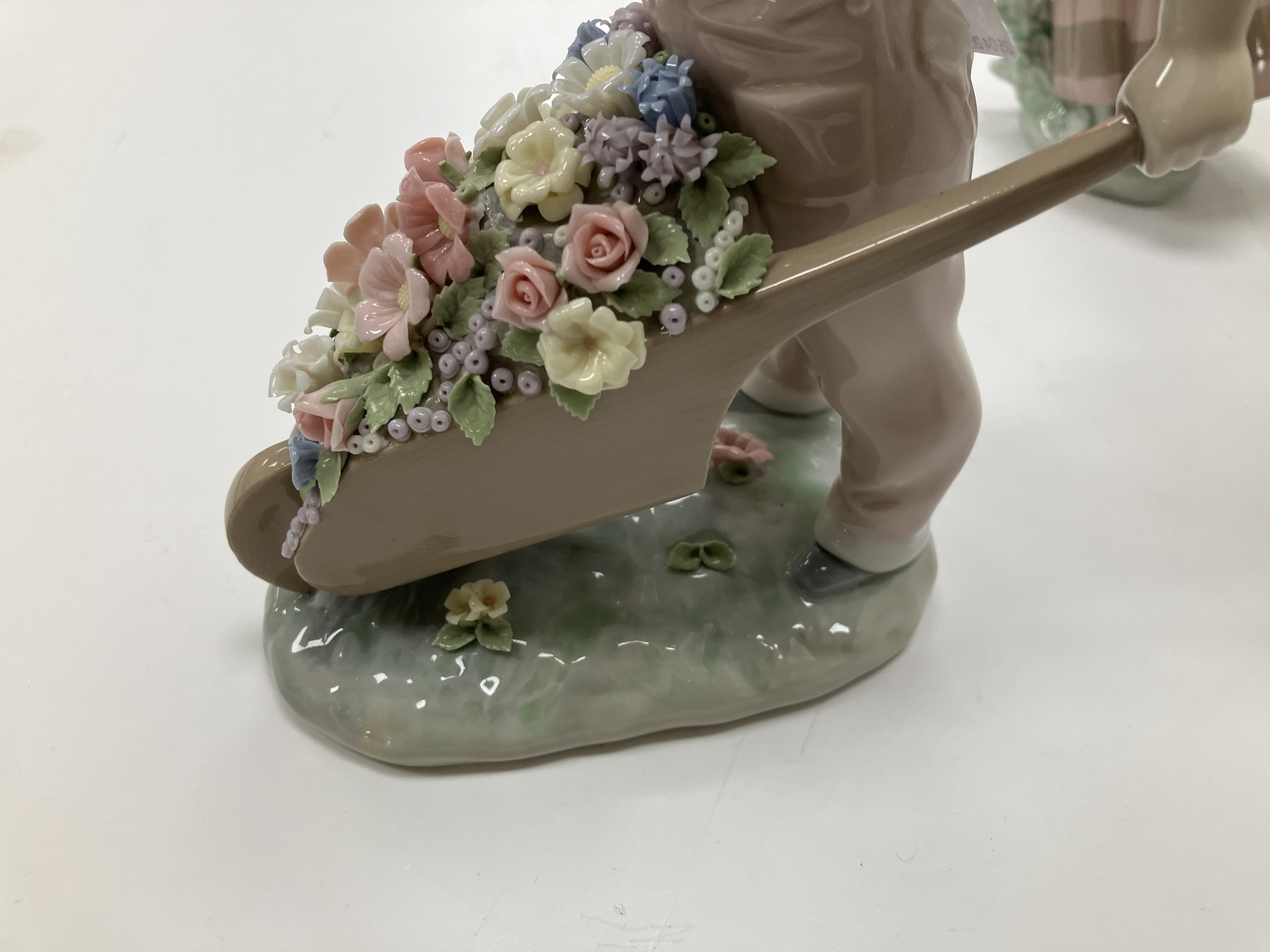 A collection of Lladro figures comprising "Little Gardener" figure of a young boy with wheelbarrow - Image 21 of 23