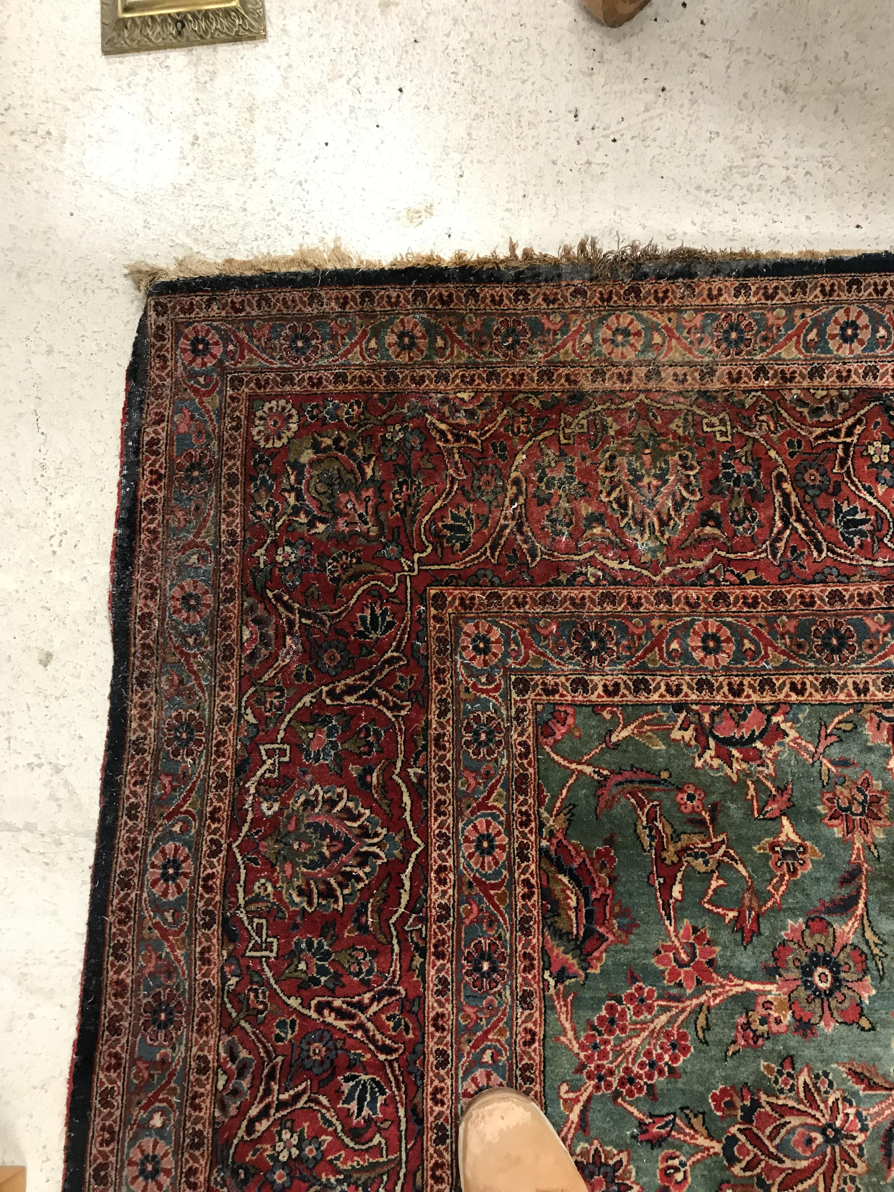 A Persian carpet, the central panel set with all-over scrolling foliate design on a teal ground, - Image 18 of 41