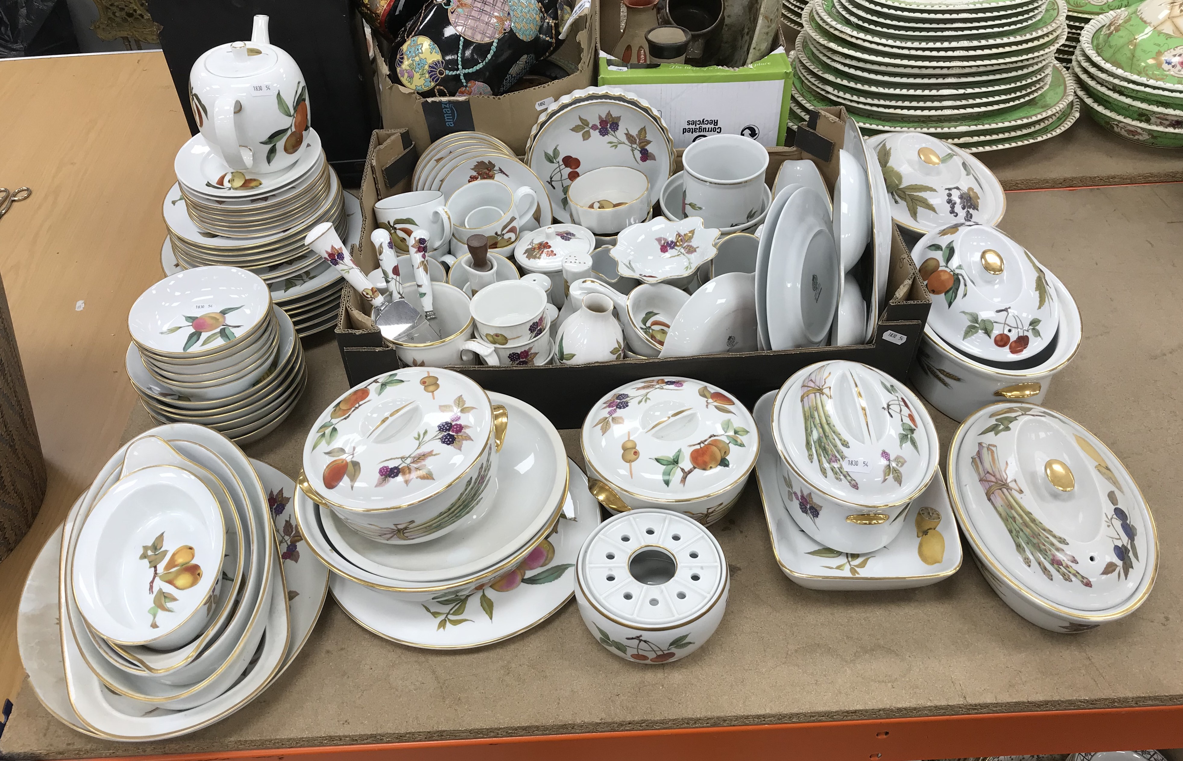 A large collection of Royal Worcester "Evesham" pattern dinner wares comprising six dinner plates,