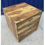 A modern military style teak brass bound chest of four long drawers,