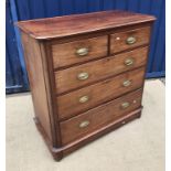 A late Victorian mahogany chest of two short over three long graduated drawers on turned feet,