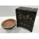 A 19th Century Japanese black lacquered and gilt decorated table top cabinet with two doors