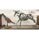 CLARE BIGGER "Running bull", a polished steel sculptural study, 77 cm long x 52.