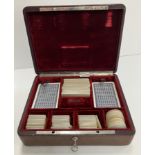 A red leather bound card and counter box, inscribed "Isakof 6Bd des Italiens Paris,