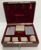 A red leather bound card and counter box, inscribed "Isakof 6Bd des Italiens Paris,