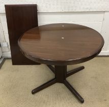 A mid to late 20th Century Danish mahogany circular extending dining table on pedestal quadruped