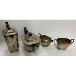 A George VI silver four piece tea set comprising teapot, water jug,