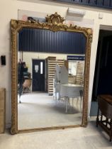 A Victorian carved giltwood and gesso framed over mantel mirror with shell and foliate carved