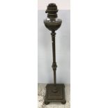 A late Victorian brass column oil standard lamp with clear glass reservoir and diamant burner 131