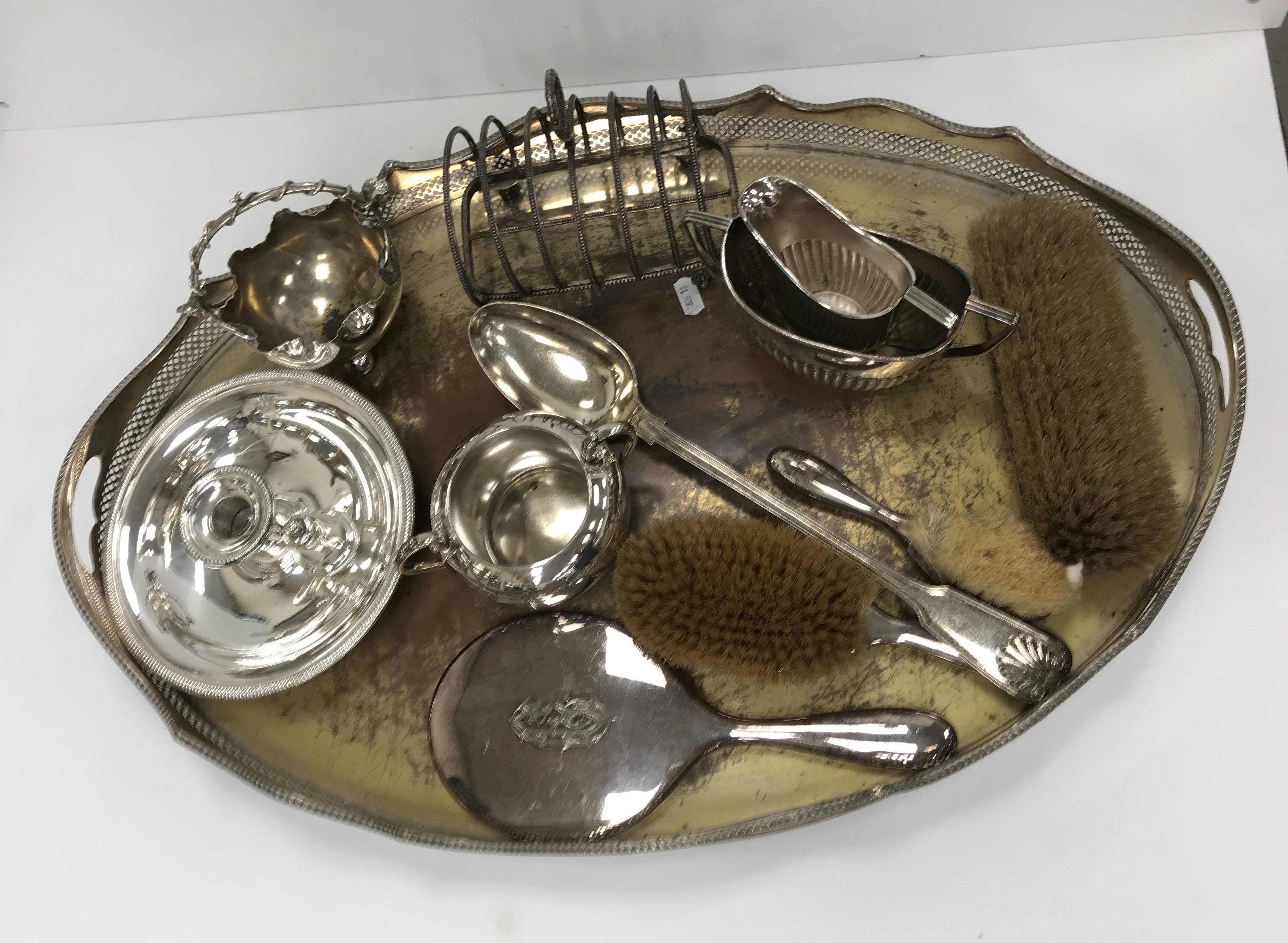 A collection of various plated wares to include two handled tray with pierced border,