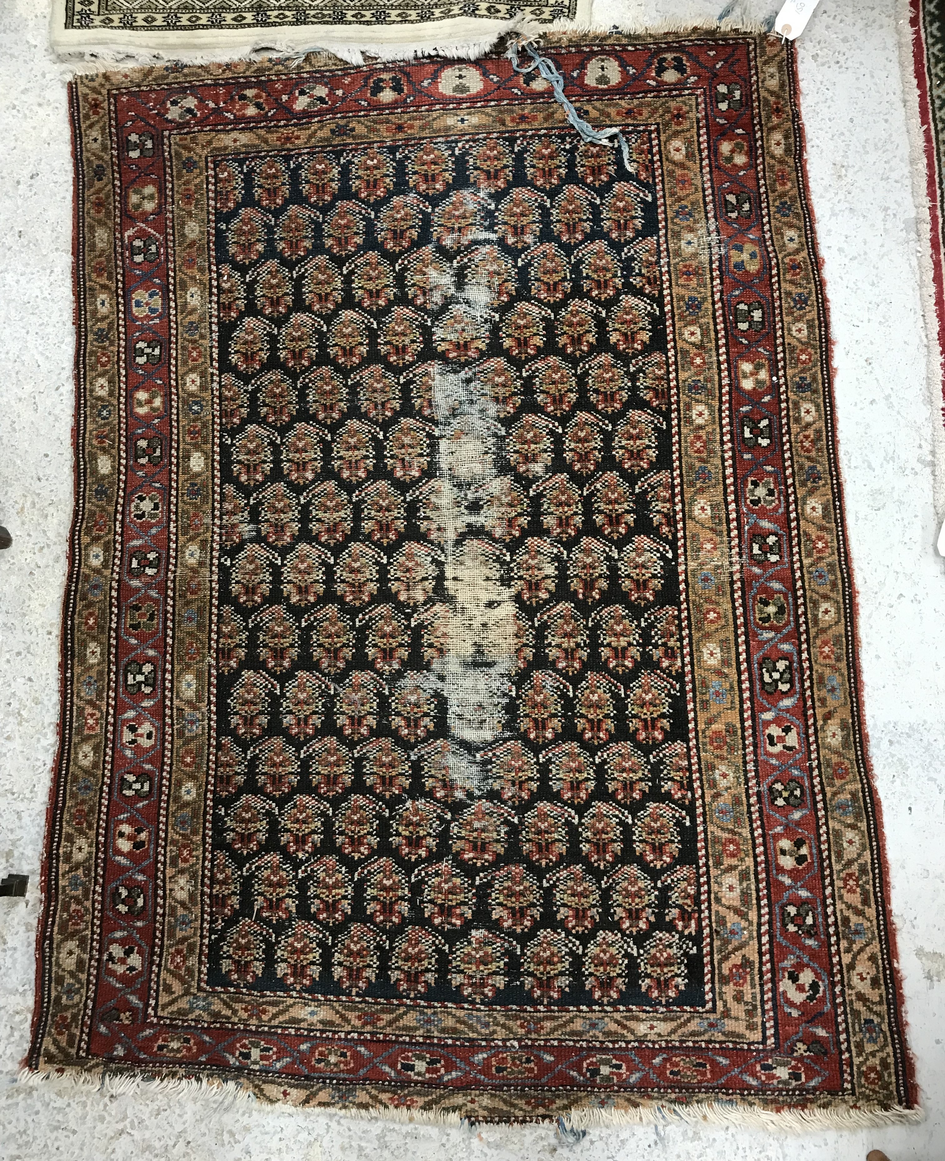 A Caucasian rug, the central panel set with stylised foliate design on a dark blue ground, - Bild 5 aus 6