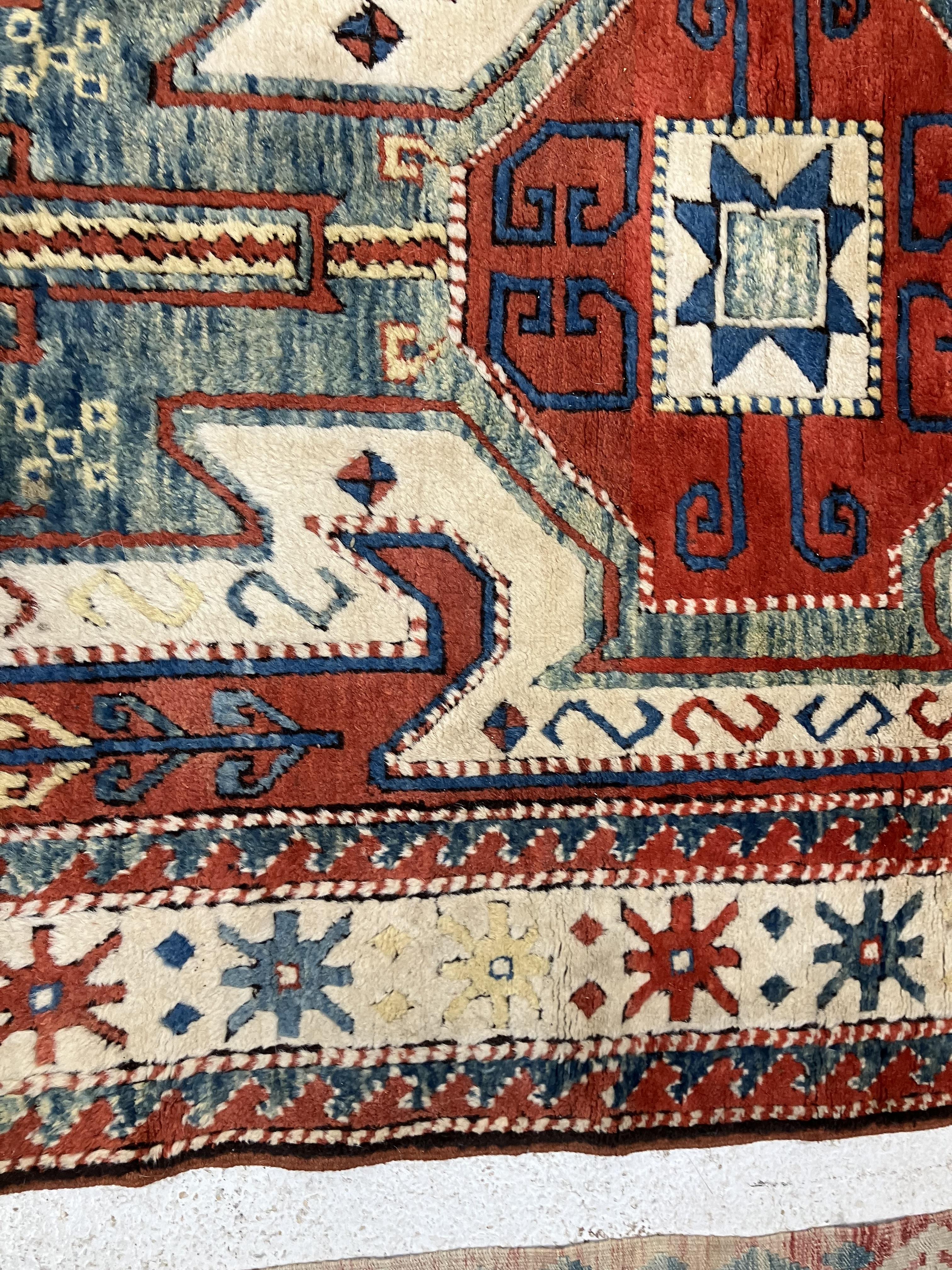 A fine Turkish carpet, - Image 8 of 16