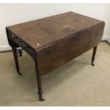 A 19th Century mahogany and ebonised drop leaf Pembroke table in the manner of Gillows,